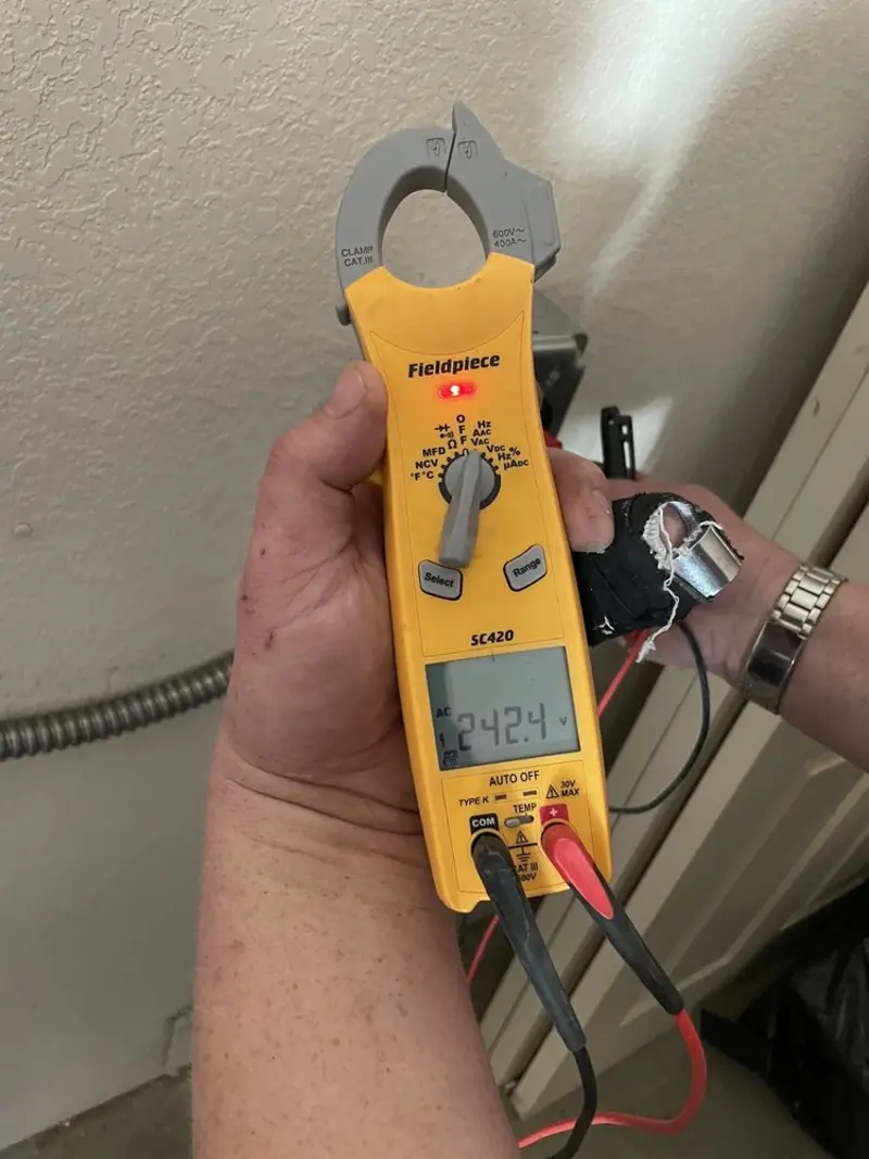 Voltage testing with clamp meter during Electrical Installation Services in Cloverdale
